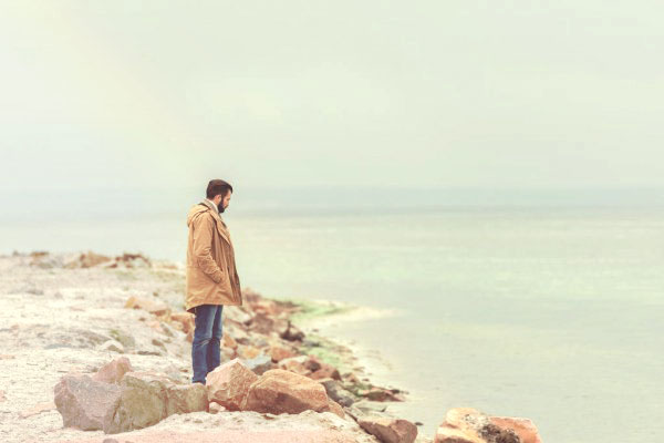 depositphotos_170782190-stock-photo-man-standing-on-seashore.jpg