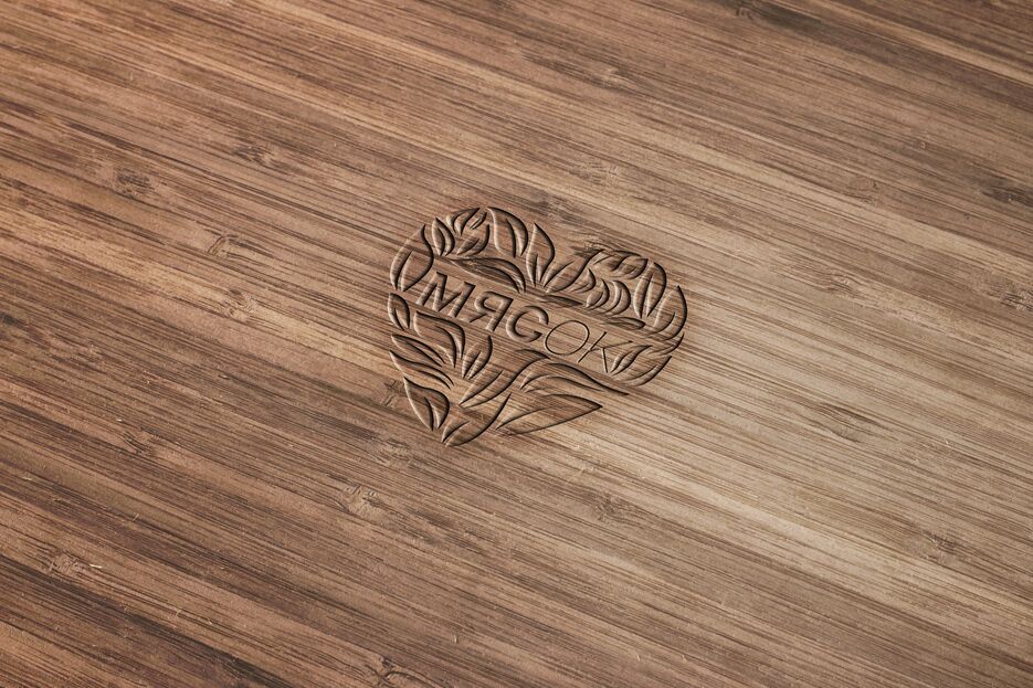 Wood Engraved Logo Mockup.png
