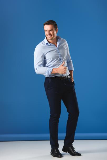 stock-photo-handsome-smiling-man-showing-thumb.jpg