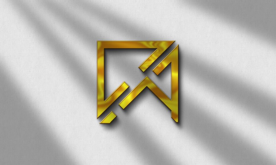 Gold Logo Mockup on grey wall.png