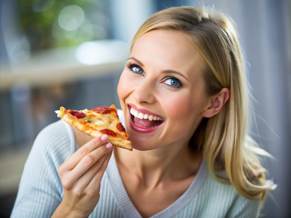 -woman-eating-pizza-and-smiling (1).jpg