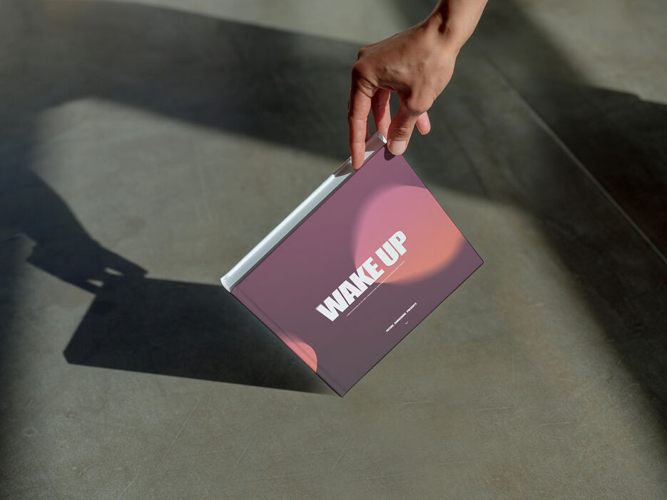 Book mockup with a gradient cover and hand detail (Mockuuups Studio).jpg