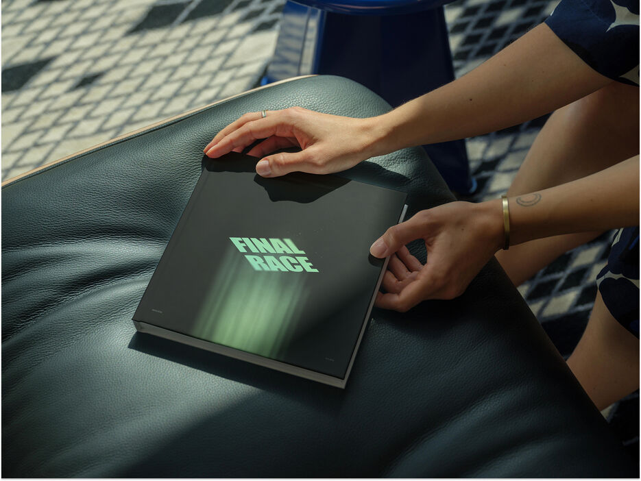 Mockup of a square book on a leather seat (Mockuuups Studio).jpg